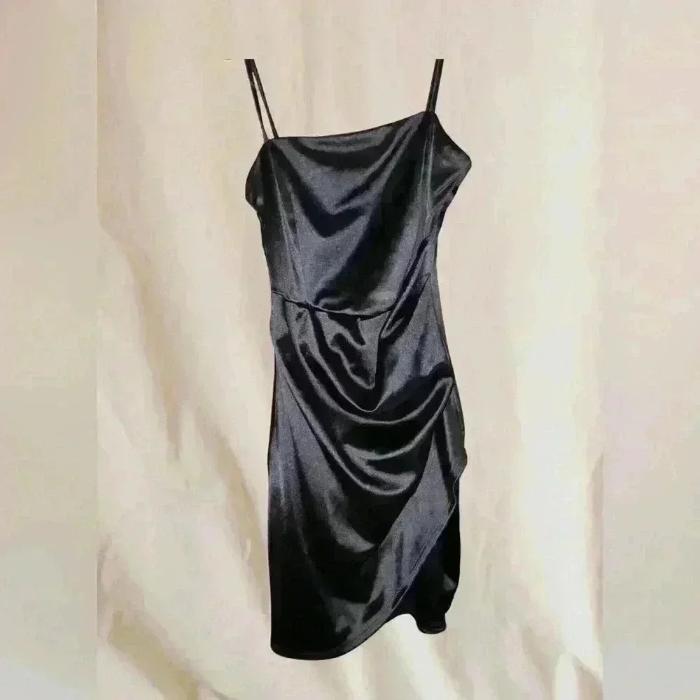Spaghetti strap, black mini cocktail dress.